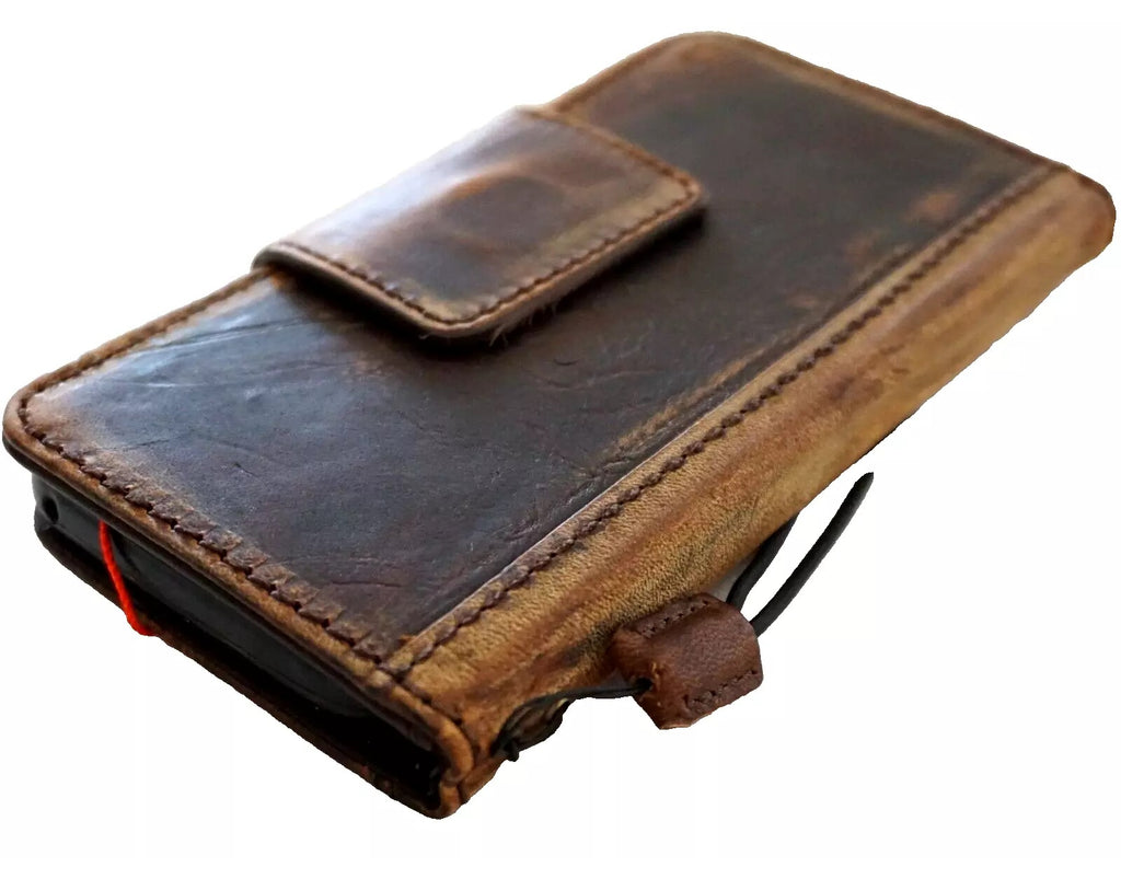 Handmade genuine leather phone case for iPhone models with vintage wallet design, magnetic closure, and artistic retro style by DAVISCASE.