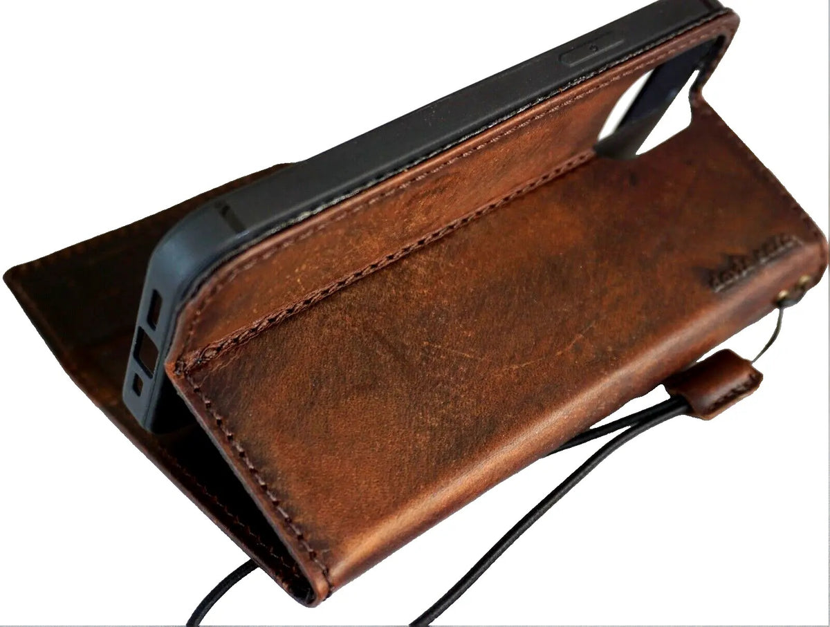 Handmade DAVISCASE leather phone case with vintage Tree of Life design for iPhone models, featuring a magnetic wallet cover and full grain leather.