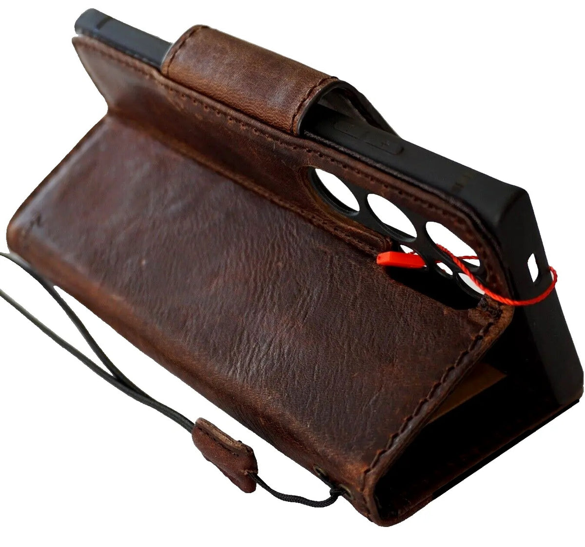 Dark brown genuine leather case for Samsung Galaxy S24 Ultra by DAVISCASE, with magnetic closure and built-in wireless charging holder.
