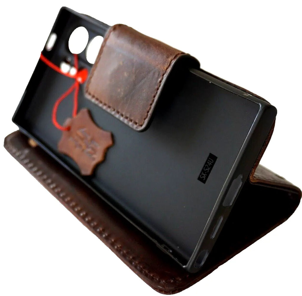 Handmade dark brown genuine leather case for Samsung Galaxy S24 Ultra with magnetic closure and rubber holder, designed for wireless charging.