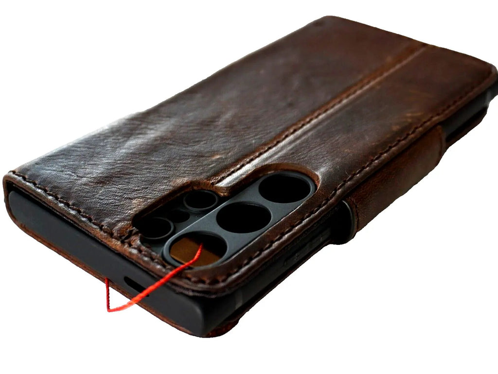 Handmade dark brown leather phone case for Samsung Galaxy S24 Ultra with wallet, rubber holder, and magnetic wireless charger support.