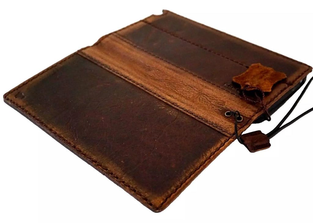 Handmade genuine leather phone case for iPhone models 8 to 16 Pro Max, featuring a wallet, book-style design, and artistic DIY holes.