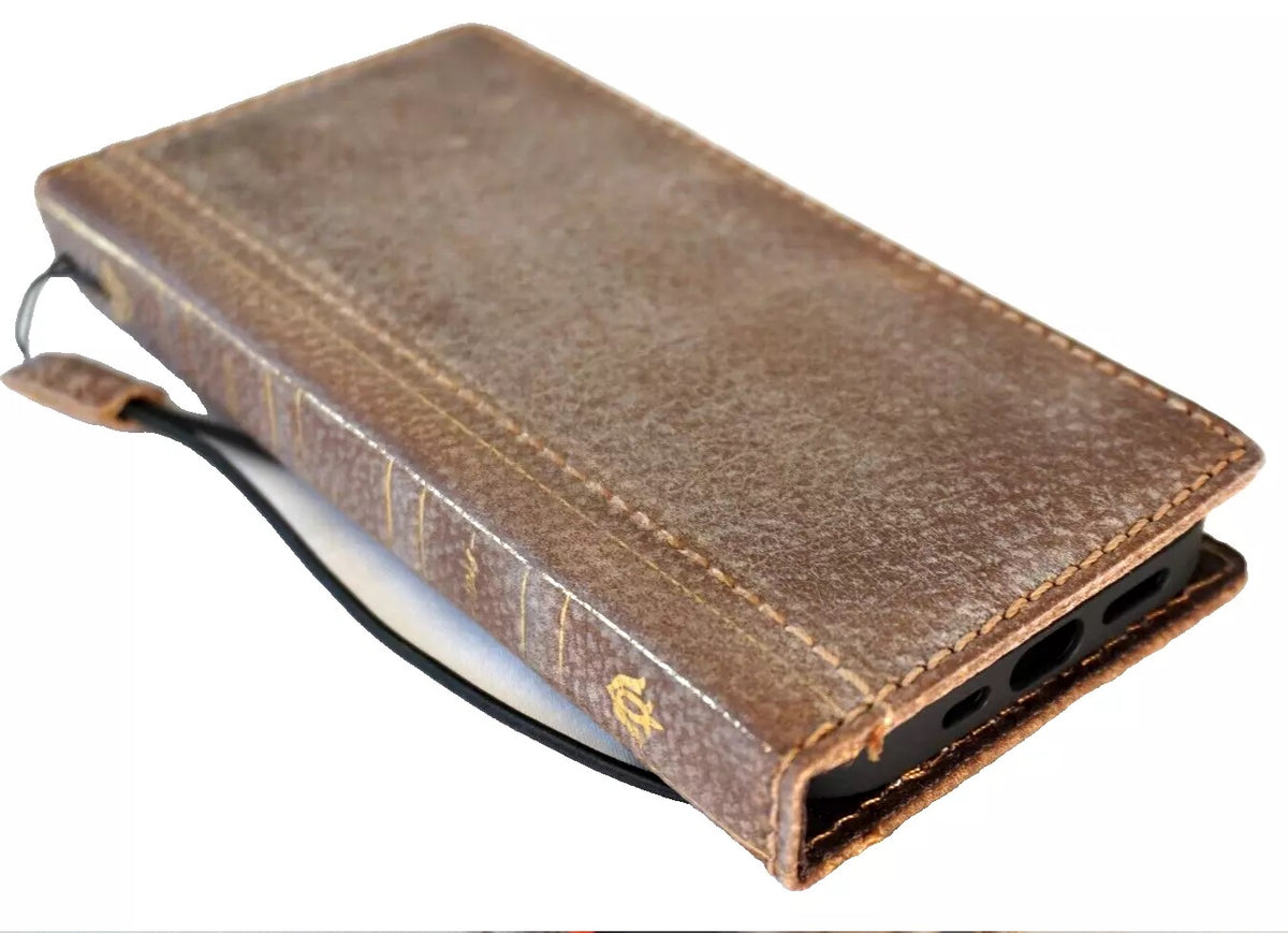 Handmade leather phone case by DAVISCASE for iPhone 11-16 Pro Max, featuring vintage book design and white stone accents.