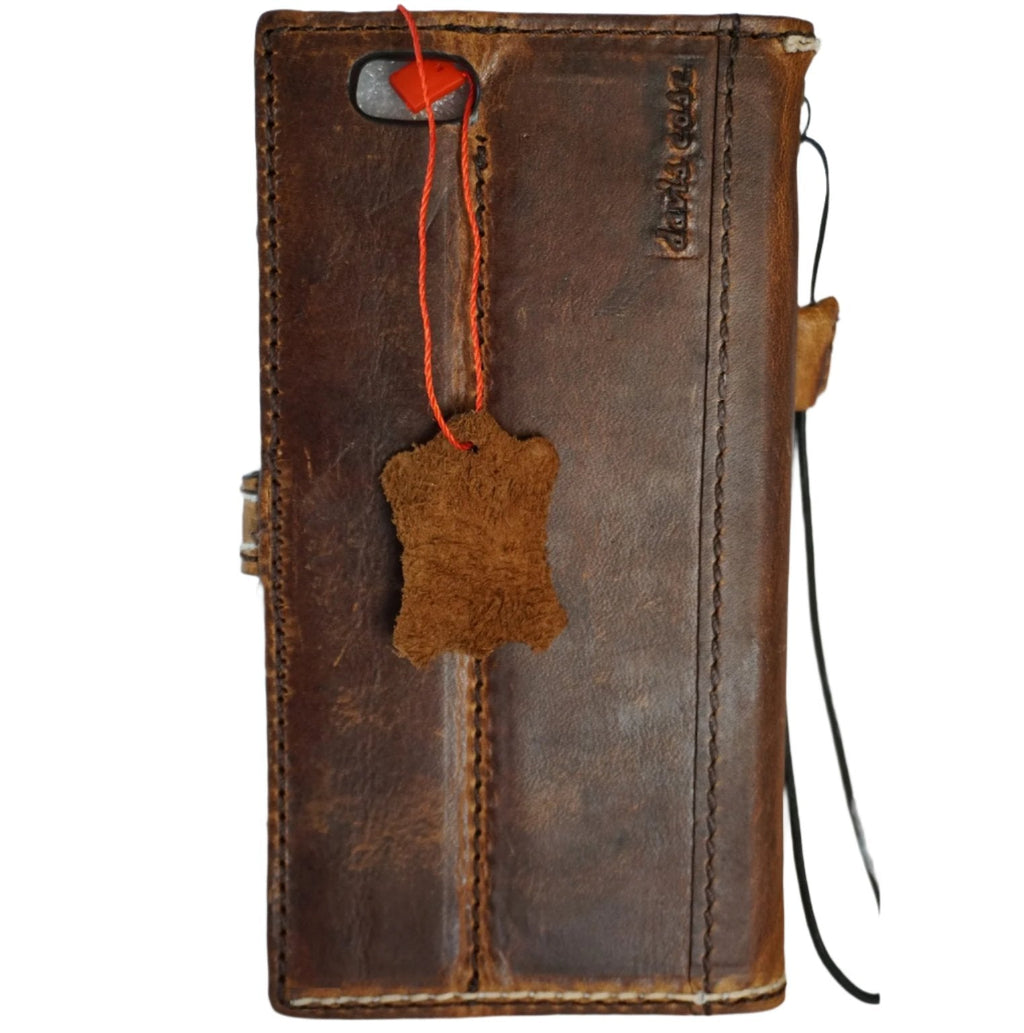 Handmade genuine leather wallet phone case for iPhone models 8 to 16 by DAVISCASE, featuring magnetic clasp and sewn oiled leather finish.