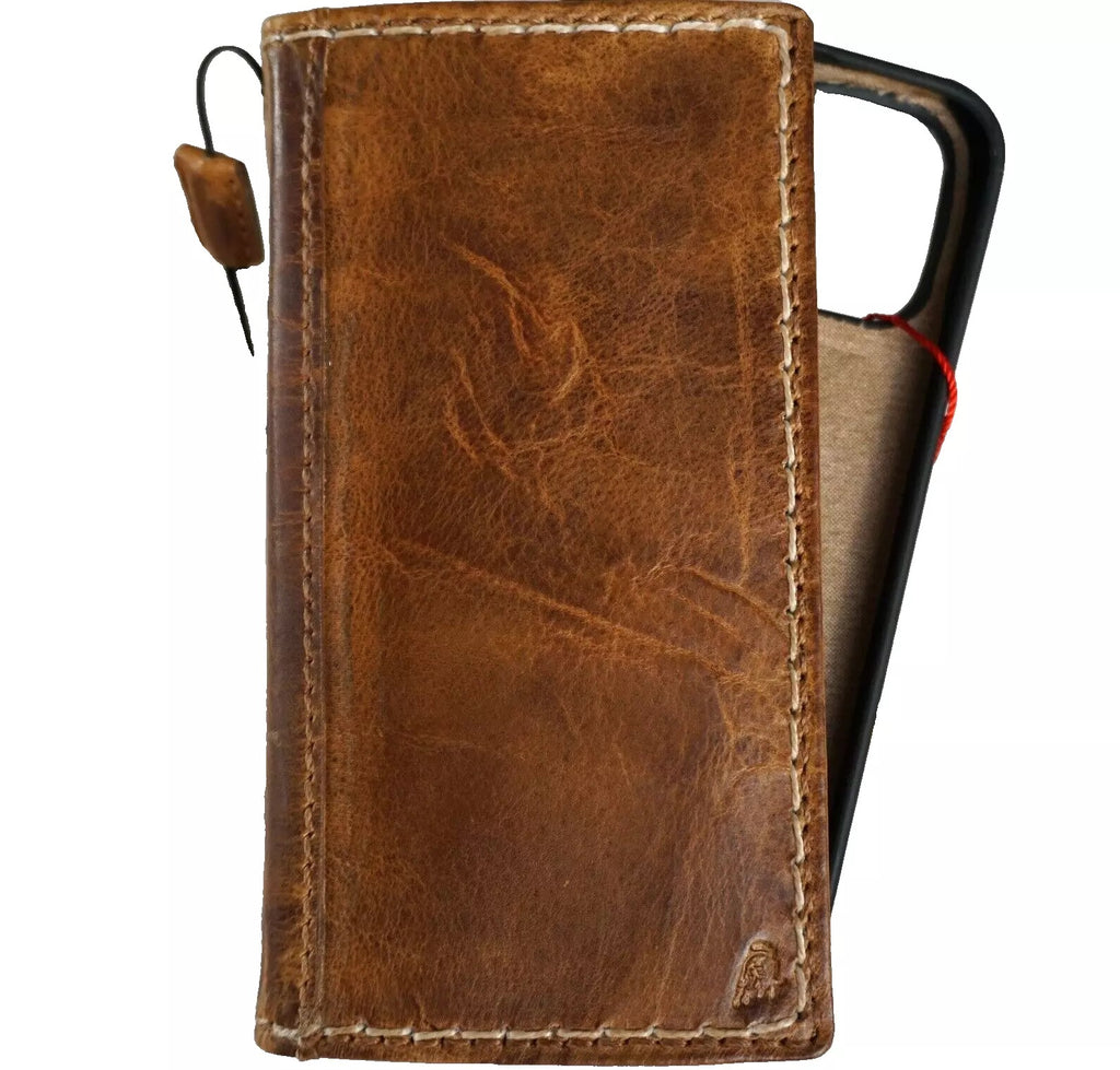 Handmade tan leather phone case with removable wallet for iPhone 12-16 Pro Max, featuring sewing details and a classic design.