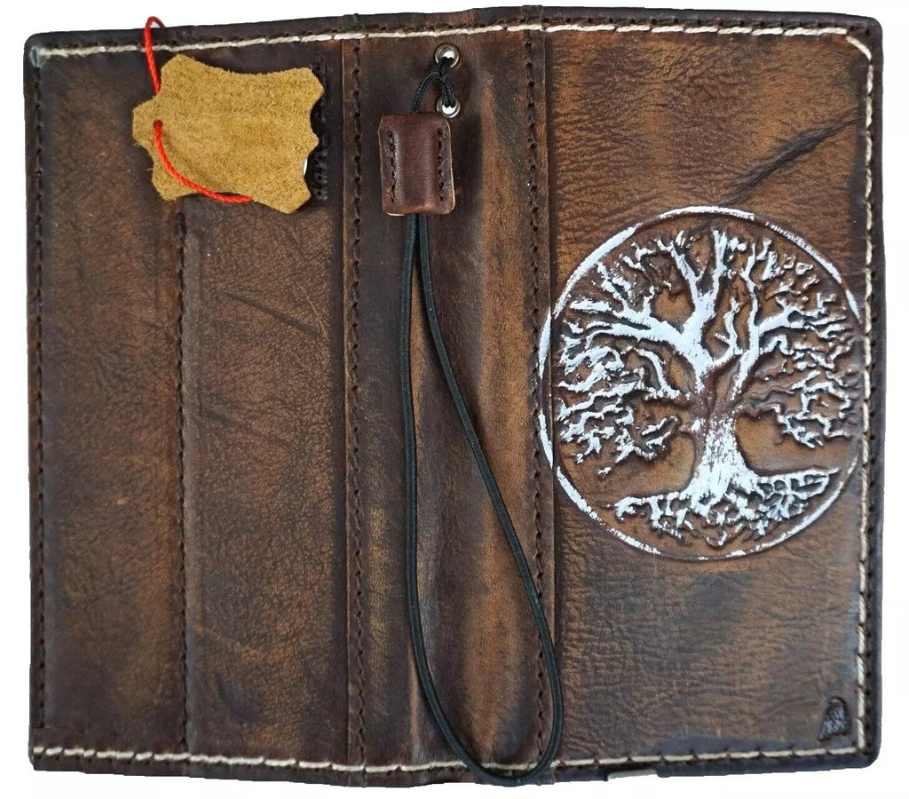 Handmade genuine leather phone case for iPhone 12-16 Pro Max, featuring embossed Tree Of Life design and wallet-style craftsmanship.