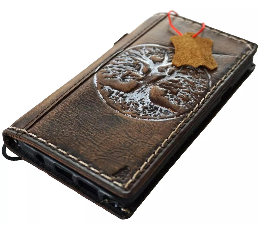 Handmade genuine leather phone case for iPhone 12-16 Pro Max, with embossed Tree of Life design and wallet features by DAVISCASE.