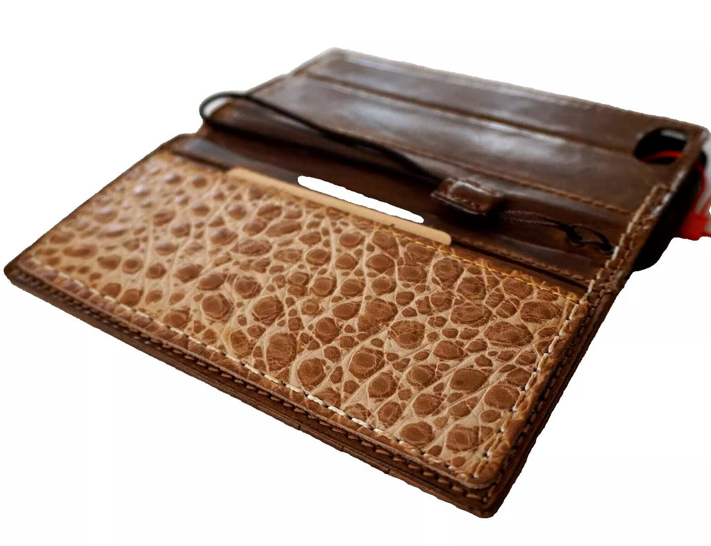 Handmade genuine leather wallet phone case for iPhone 13-16 Pro Max and Plus models, featuring sewing details and removable design.