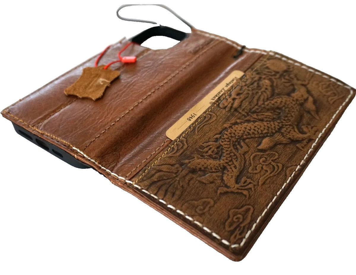 Handmade genuine leather phone case for iPhone 12-17 Pro Max with removable wallet, featuring hand-sewn Zamch Dragon design.