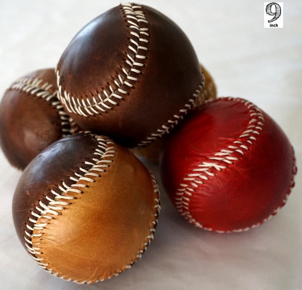 Handmade vintage red leather baseball with detailed stitching, crafted by DAVISCASE using thread and needle.