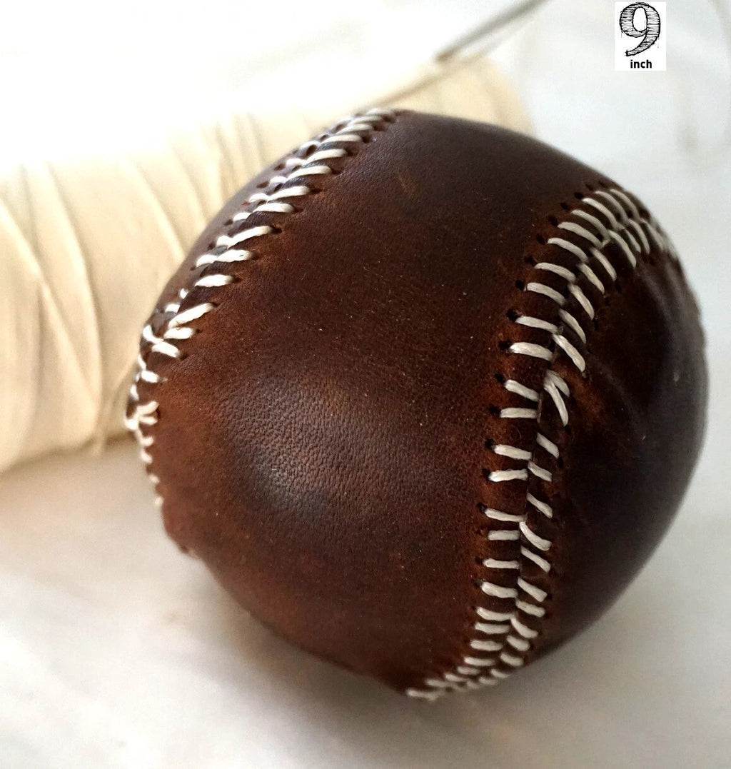 Handmade vintage red leather baseball with stitching, created with thread and needle by DAVISCASE.