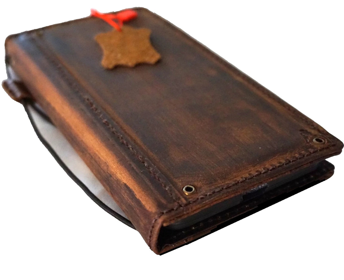 Handmade genuine leather wallet phone case for iPhone 8 to 17 Pro Max by DAVISCASE, featuring copper hole design and DIY craftsmanship.