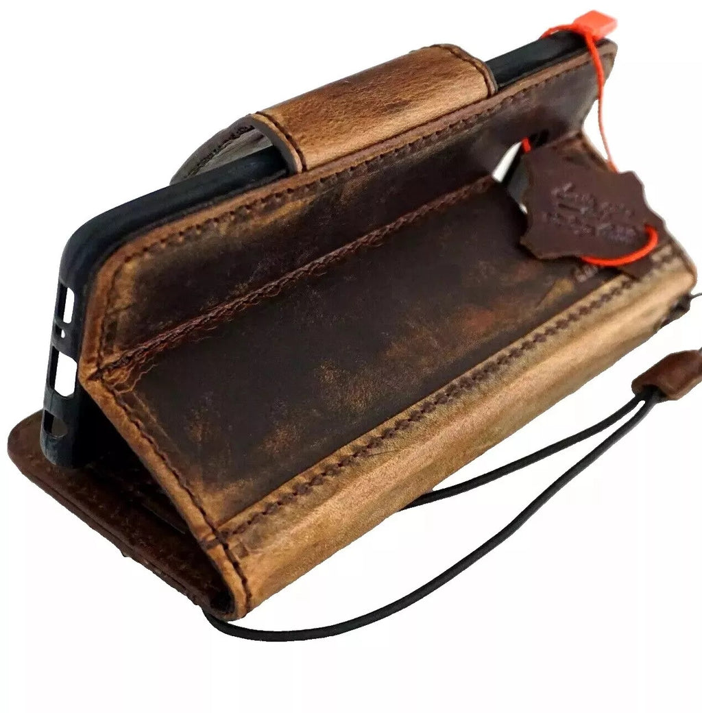 Handmade DAVISCASE genuine leather phone case with magnetic closure for iPhone models, featuring wallet-style design and copper accents.