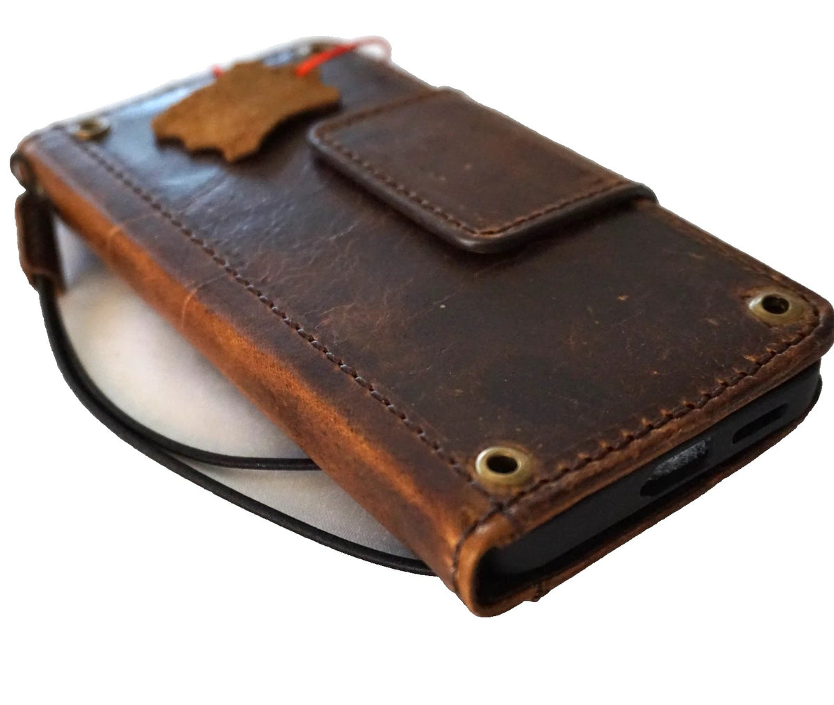 Handmade genuine leather phone case for iPhone models 12 to 17, with magnetic clasp and limited edition design by DAVISCASE.