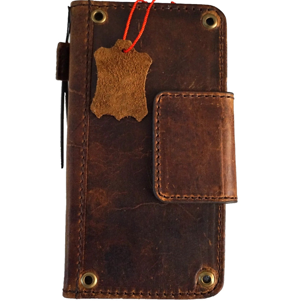 Handmade genuine leather phone case for iPhone models, with magnetic clasp, copper holes, and wallet-style design by DAVISCASE.