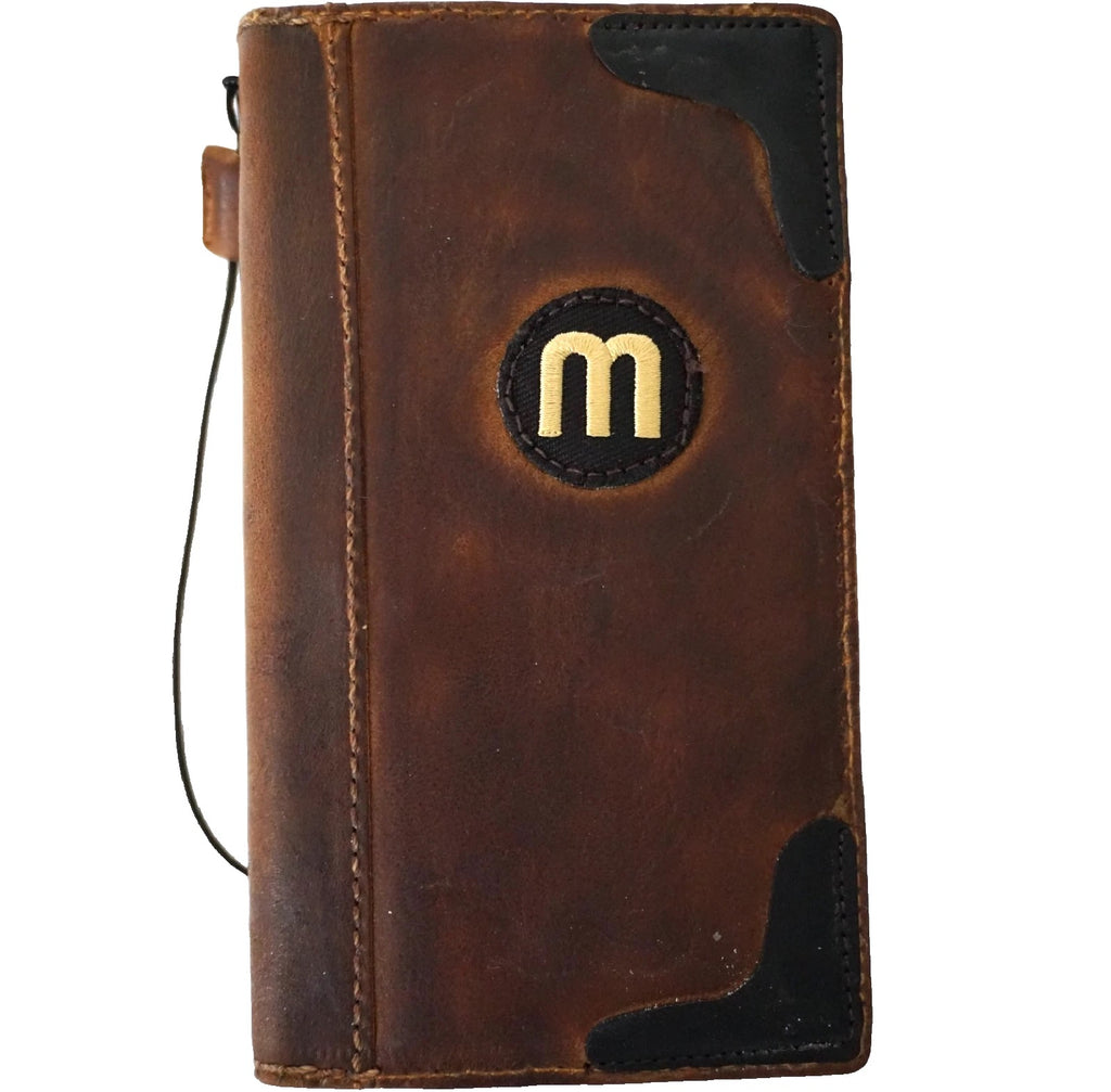 Handmade genuine leather phone case for Apple iPhone models, featuring a football wallet book cover design by DAVISCASE.
