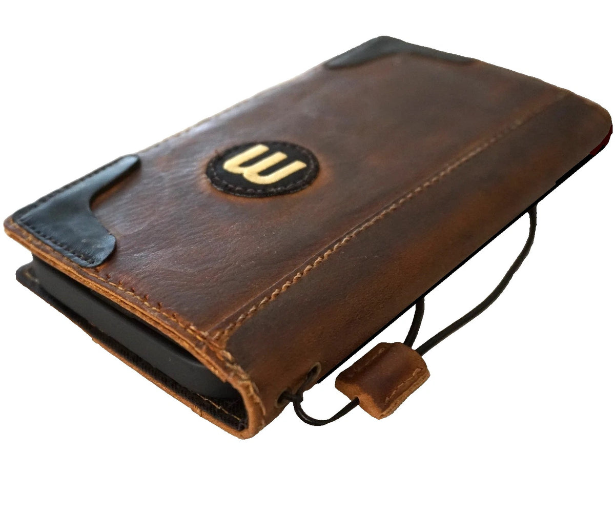 Handmade genuine leather football wallet case for Apple iPhone models 12 to 17, with a rugged oiled finish and hand-stitched details.