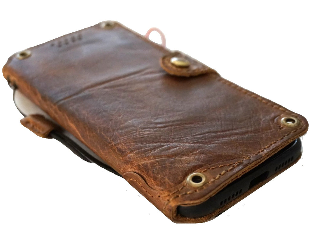 Hands-on view of a genuine leather DAVISCASE wallet phone case for Galaxy S26, Z Fold 8, and Note series with clasp detail.