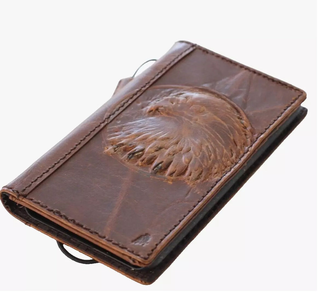 Handmade genuine leather phone case by DAVISCASE for iPhone models, with vintage eagle and falcon design, card slots, and wallet features.