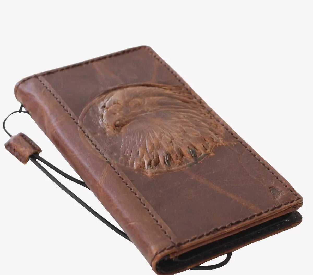 Handmade genuine leather phone case for iPhone models with eagle craft falcon design, featuring card slots and vintage wallet style.
