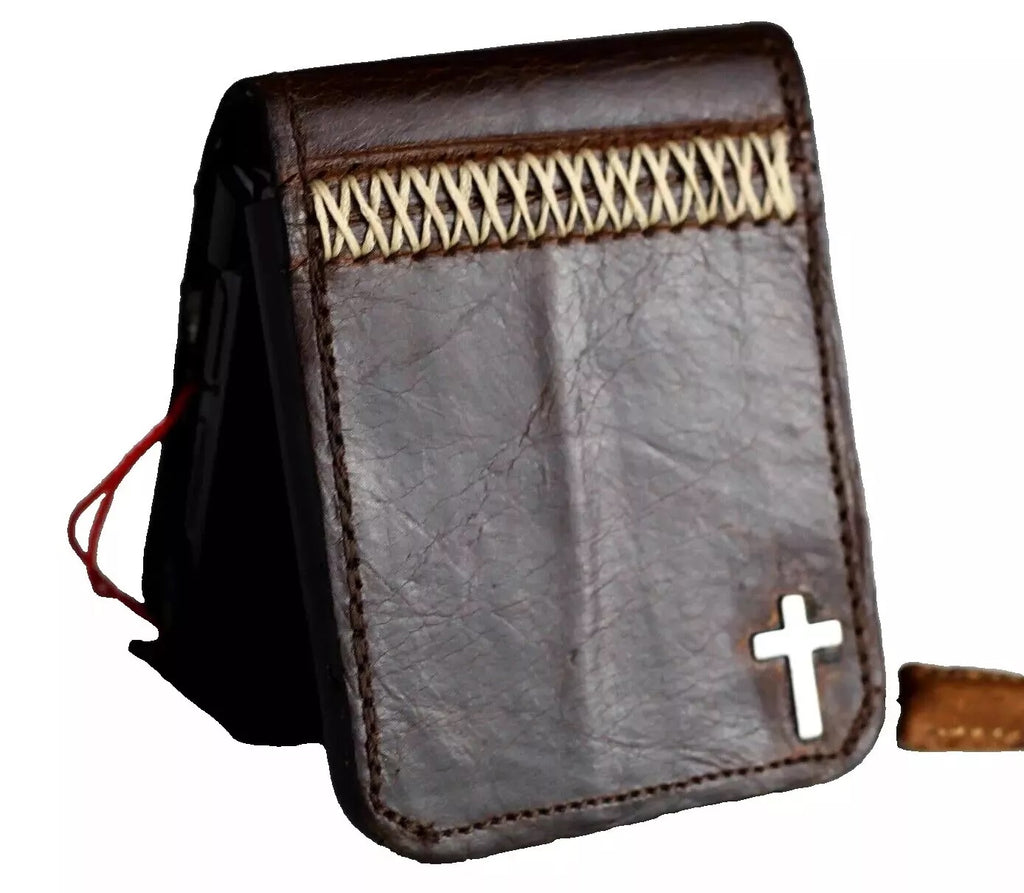 Handmade genuine leather phone case for Galaxy Z Flip series, featuring wallet style design and cross stamp detail.