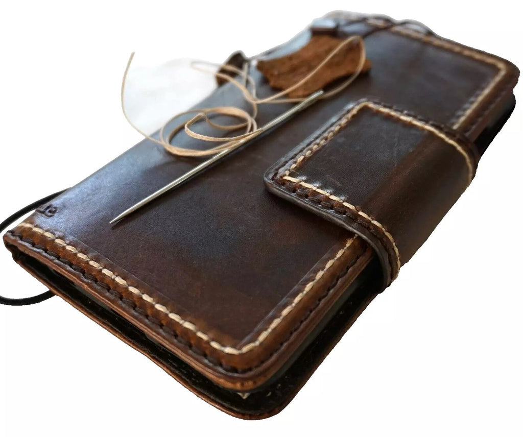 Dark genuine leather wallet case for Google Pixel Fold, hand-stitched with book-style closure, designed by DAVISCASE.