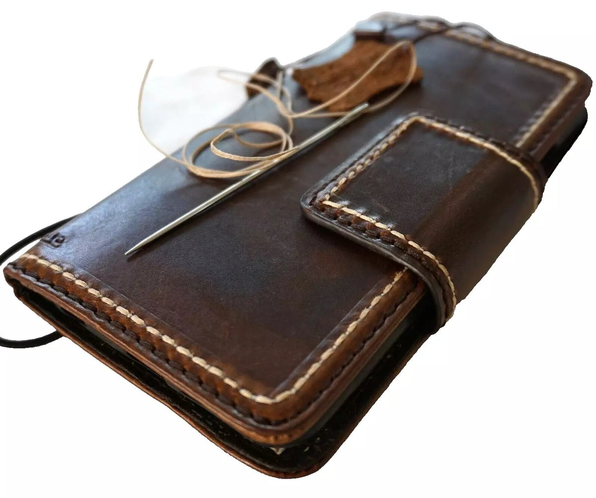 Dark genuine leather wallet case for Google Pixel Fold, hand-stitched with book-style closure, designed by DAVISCASE.