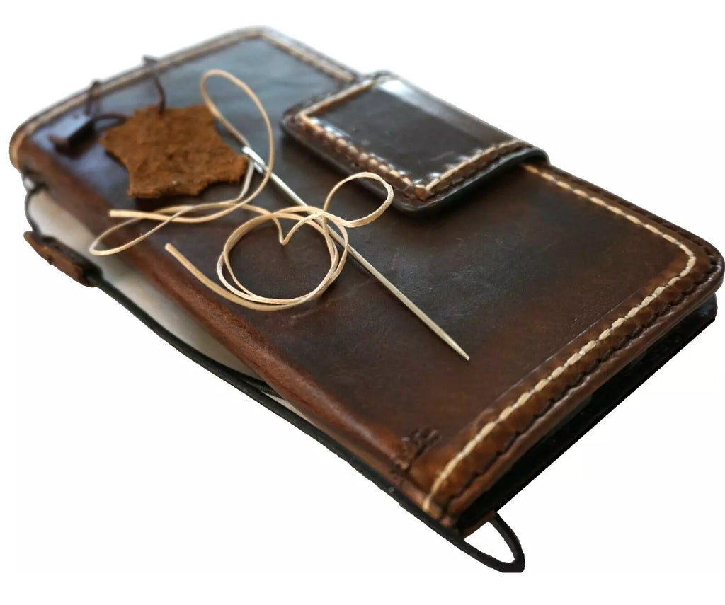 Dark genuine leather case for Google Pixel Fold and Pixel models, featuring a book wallet design with hand-stitched closure.