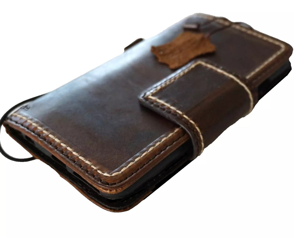 Dark genuine leather Google Pixel Fold case with hand-stitched design and wallet closure, designed for models 10, 7A, 8A, 7, 8, 9 Pro XL, and 6A.