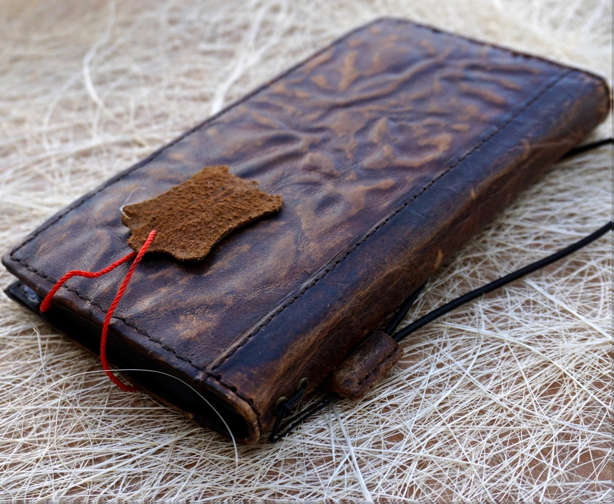 Handmade genuine leather wallet phone case by DAVISCASE for iPhone 16, 15 Pro Max, 14, 8 Plus with a wrinkled, luxurious finish.