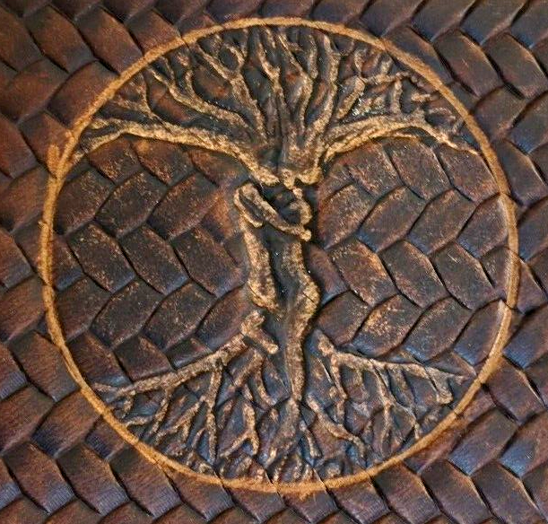 Handmade DAVISCASE leather phone case for iPhone 12-16 Pro Max with embossed Tree of Life design, crafted in genuine leather.