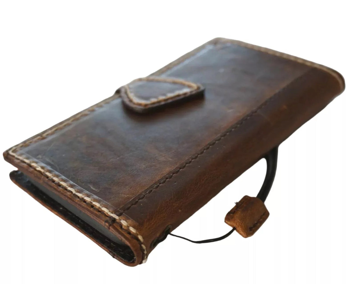 Handmade genuine leather phone case for Apple iPhone models, featuring a wallet design with magnetic closure by DAVISCASE.