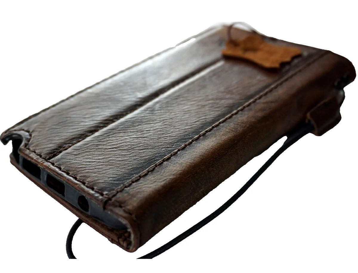 Handmade DAVISCASE leather phone case with vintage Tree of Life design for iPhone 11-15 Pro Max, featuring a wallet and coin holder.