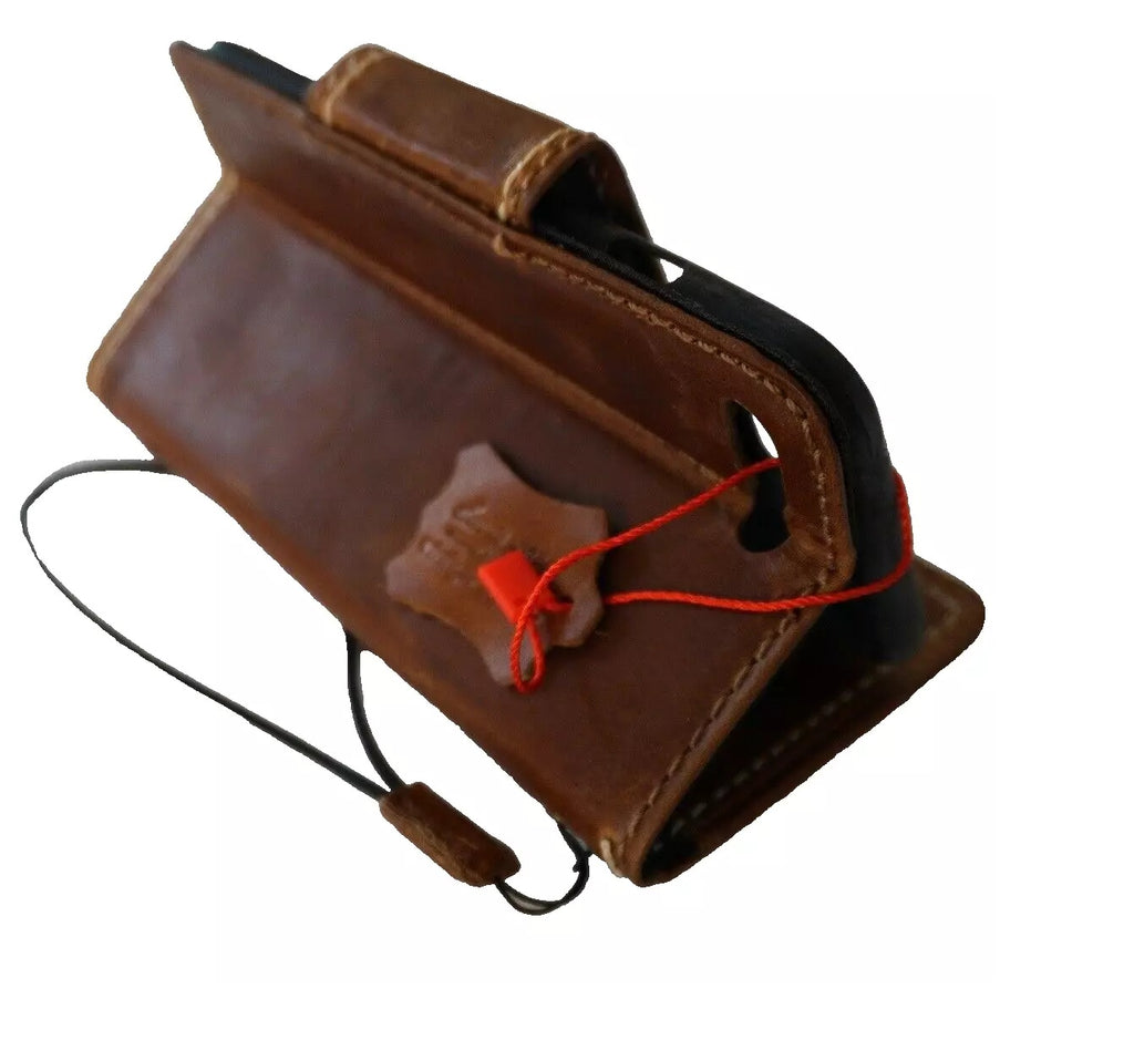 Handmade genuine leather phone case for Apple iPhone models, featuring magnetic closure and wallet-style design by DAVISCASE.