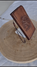 Handmade genuine leather phone case by DAVISCASE for iPhone 11 to 15, vintage style with Tree of Life design and magnetic closure.
