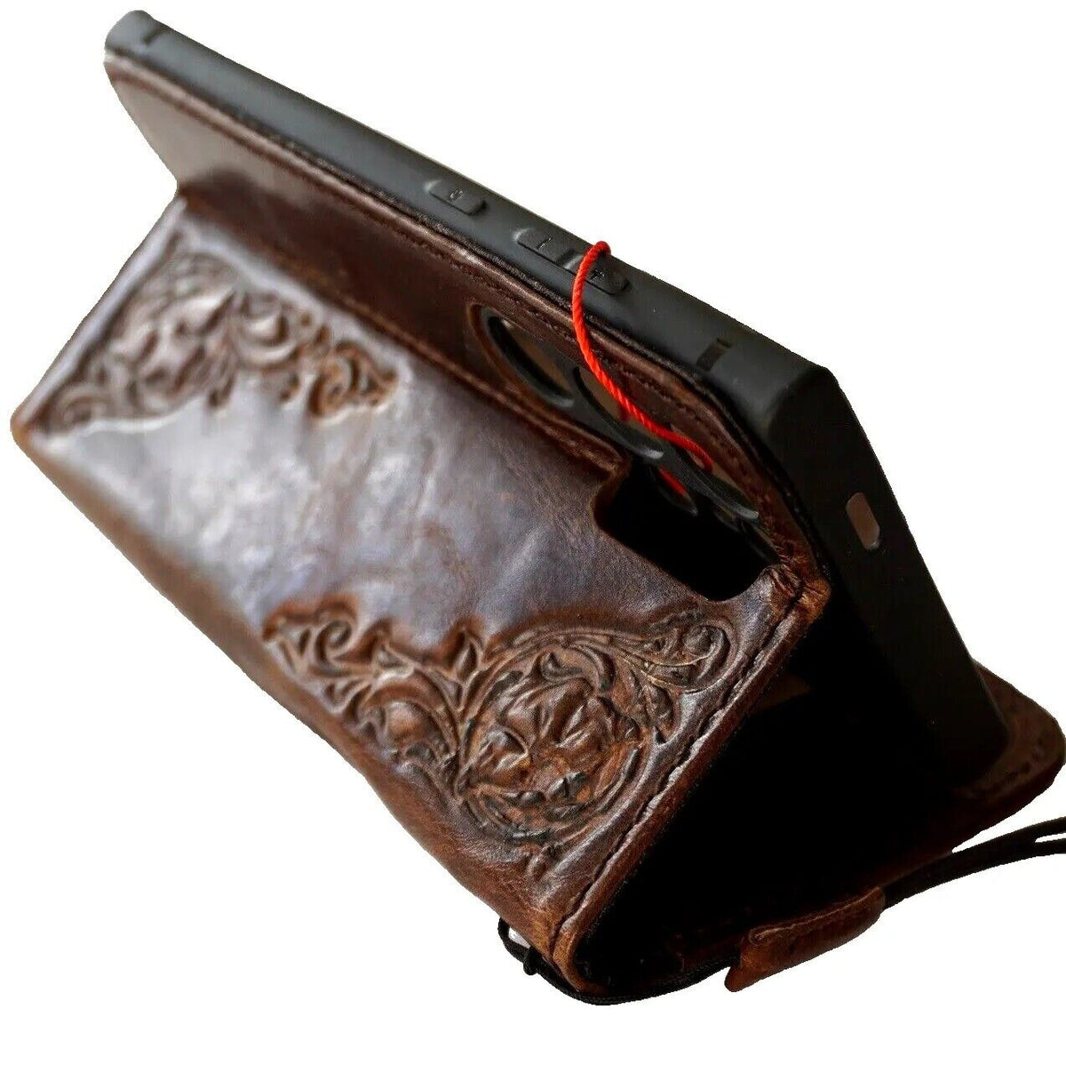Handmade dark brown leather case for Samsung Galaxy S24 Ultra with magnetic closure, rubber holder, and wireless charging compatibility.