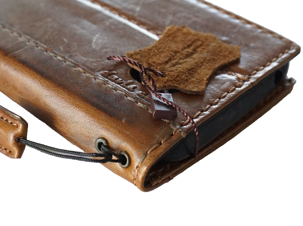 Genuine leather Google Pixel 7 Pro case by DAVISCASE featuring a retro tan wallet design with stand and wireless charging compatibility.