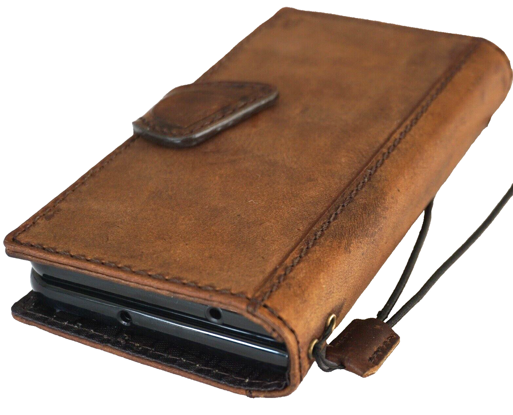 Genuine leather Google Pixel Fold case by DAVISCASE with book wallet design, stand feature, and wireless charging compatibility.