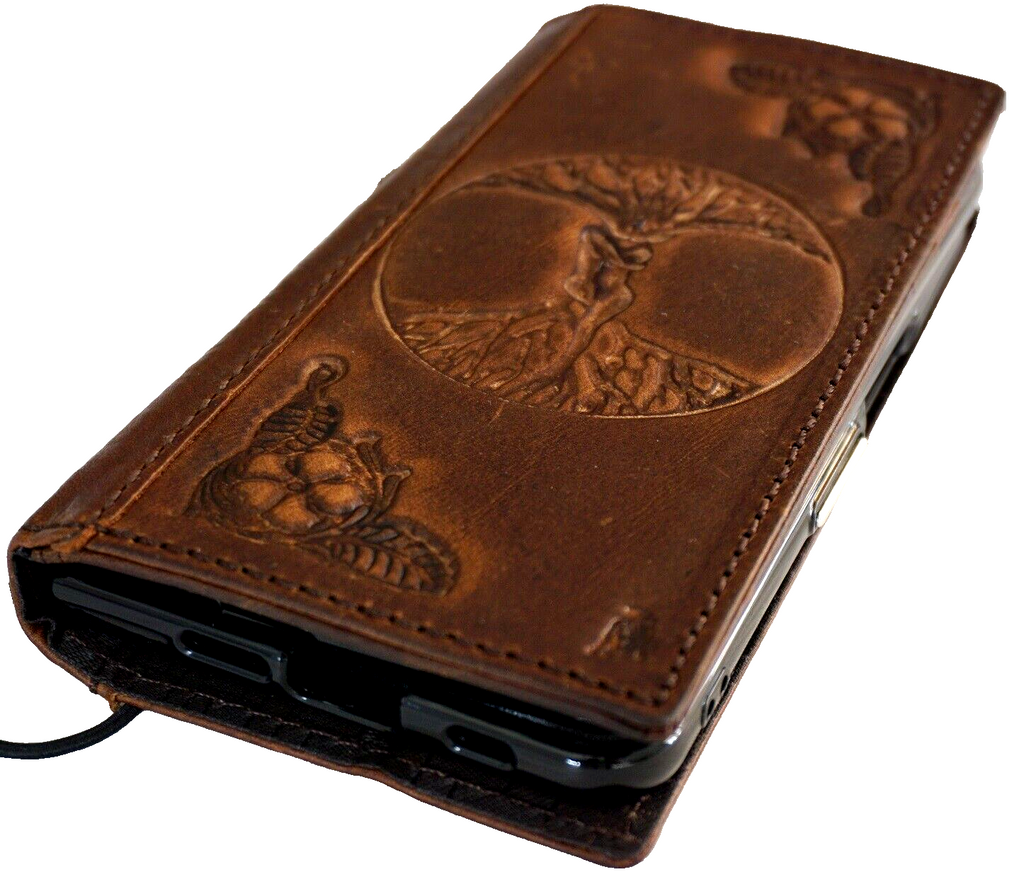 Genuine leather Google Pixel Fold case by DAVISCASE featuring The Tree of Life, Adam and Eve design, with stand and wireless charging cutouts.