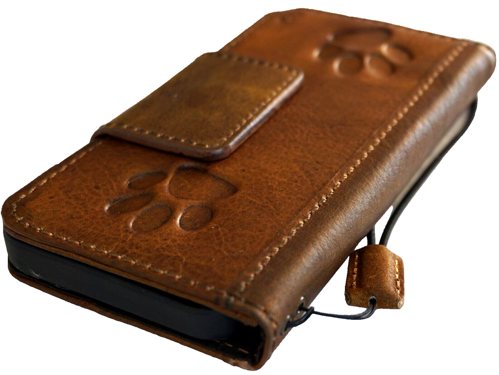 DavisCase genuine leather wallet case for Google Pixel 7 Pro with magnetic closure and dog paw design on brown leather.