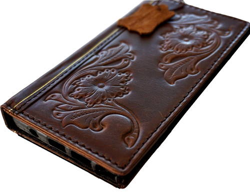 Handmade leather Galaxy Z Fold case with vintage Bible-style floral design by DAVISCASE, featuring intricate leather craftsmanship.