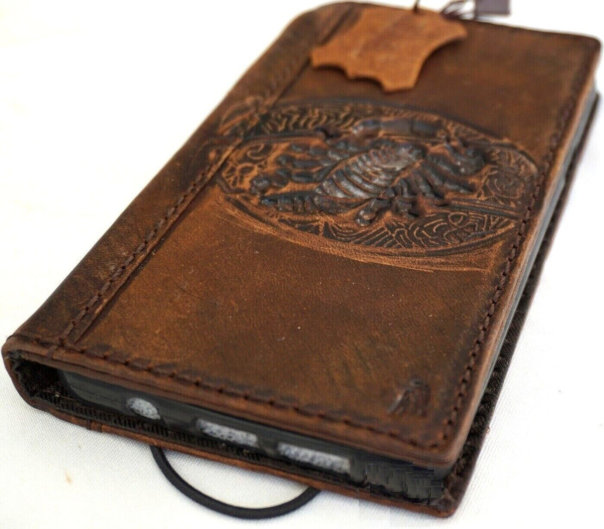 Handmade genuine leather phone case for iPhone 12-16 Pro Max by DAVISCASE, featuring a scorpion craft and luxury mini art design.