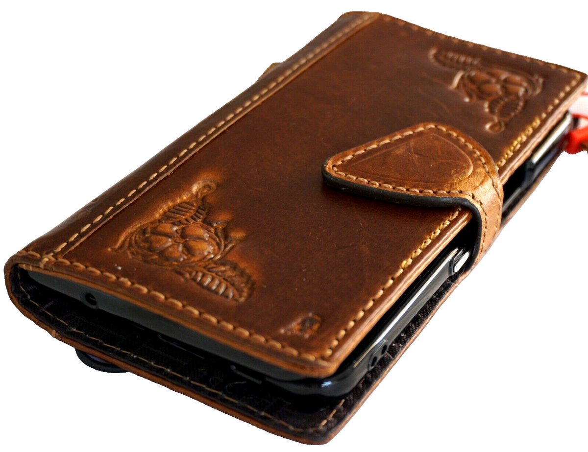 Genuine leather Google Pixel Fold case by DAVISCASE featuring wallet design, stand, and closure in tan for 5G wireless charging.