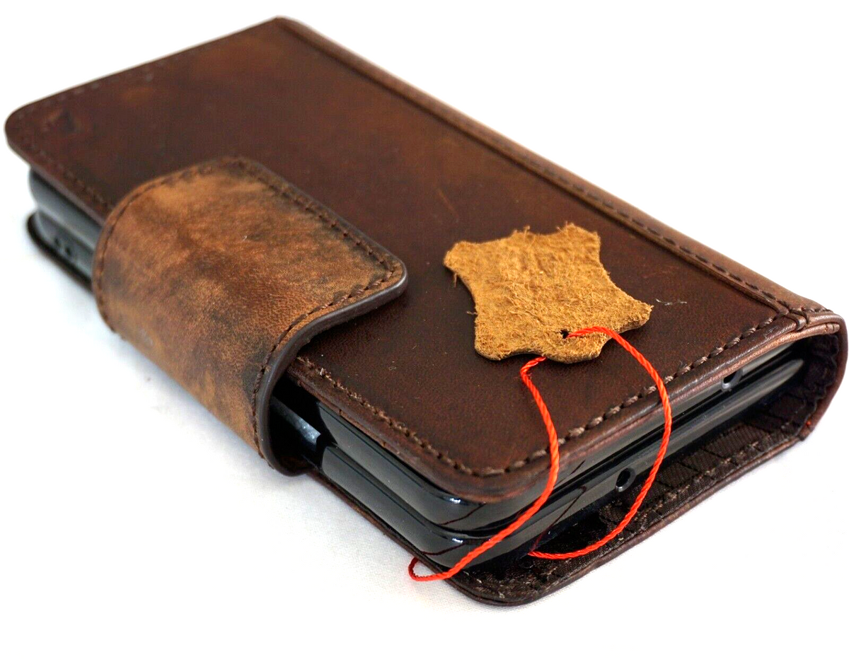 Genuine leather Google Pixel Fold case by DAVISCASE with book wallet design, stand feature, and wireless charging compatibility.