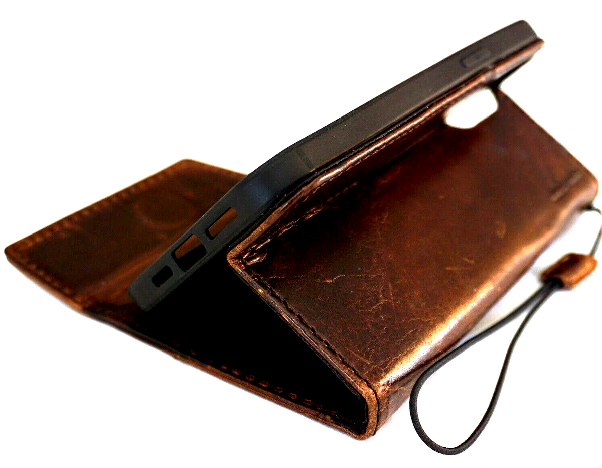 Handmade genuine leather phone case for Apple iPhone models, featuring wallet style, magnetic closure, and stylish horse design.