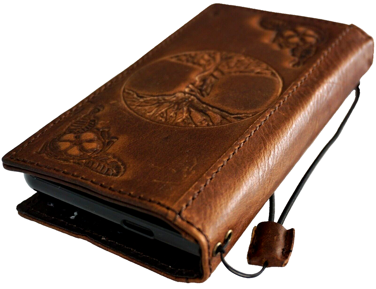 Genuine leather Google Pixel Fold case by DAVISCASE featuring Tree of Life design, wallet style with stand and wireless charging compatibility.