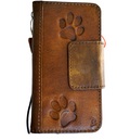 DavisCase genuine leather wallet case for Google Pixel 7 Pro with magnetic closure and dog paw design, opens to reveal card slots.