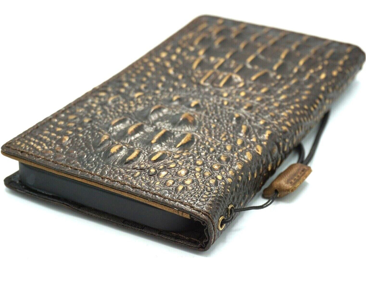 Handmade genuine leather phone case for iPhone models with crocodile-style design, featuring a wallet book style and art craft details.