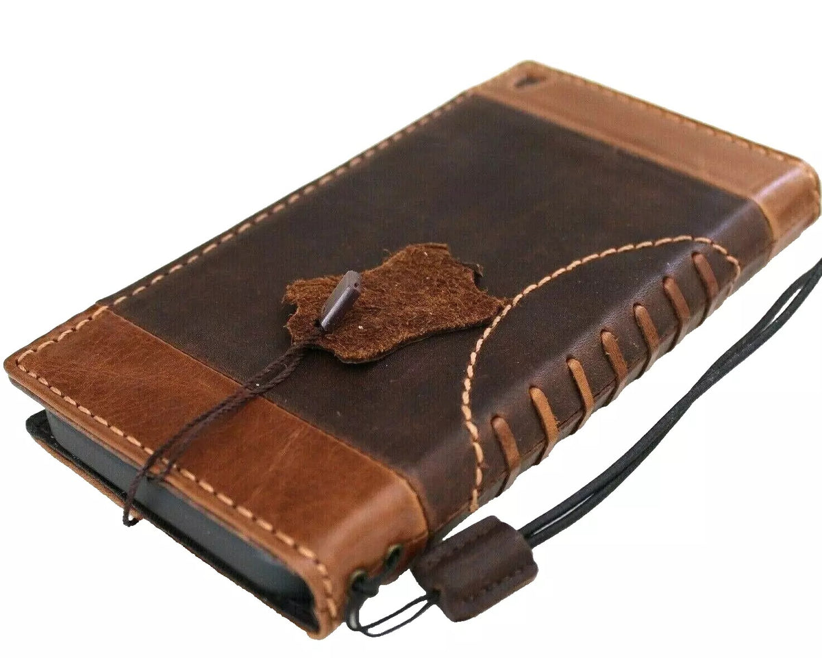 Handmade genuine leather phone case for iPhone models, featuring a mini football design and wallet-style cover by DAVISCASE.