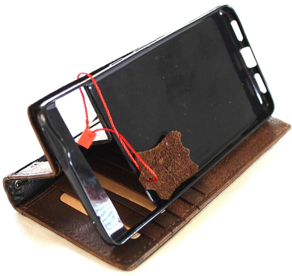Genuine leather Google Pixel 7 Pro case by DAVISCASE featuring a vintage book wallet design with stand and rustic polish finish.